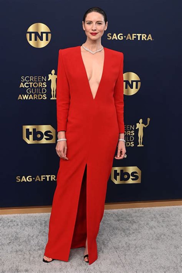 Caitriona Balfe Stuns In Plunging Red Saint Laurent Gown With Thigh-High Slit At SAG Awards