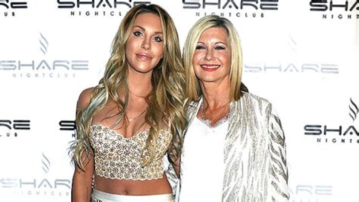 Chloe Lattanzi Wipes Away Tears As She Admits She ‘Talks To’ Late Mom Olivia Newton-John ‘Every Day’ In New Interview