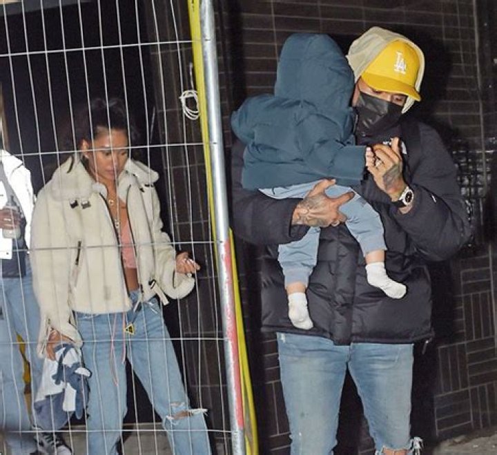 Chris Brown Cradles Son Aeko, 10 Mos., While Enjoying A Night Out In London With Ammika Harris