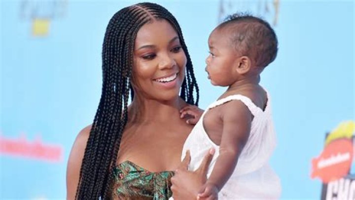 Gabrielle Union, 47, Stuns In A Rainbow Bikini While High-Fiving Kaavia, 1, During Backyard Picnic