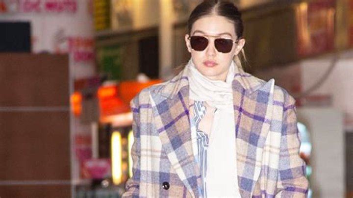 Gigi Hadid Conceals Her Growing Baby Belly In A Flannel Shirt In New Pics Posted By Mom Yolanda