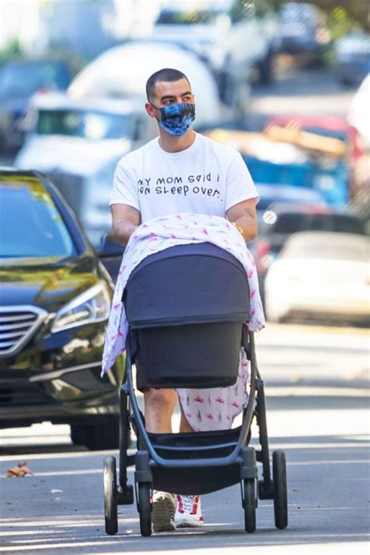 Joe Jonas Heads Out For A Solo Stroll With Daughter Willa, 3 Months, & Shows Off His Buzzcut