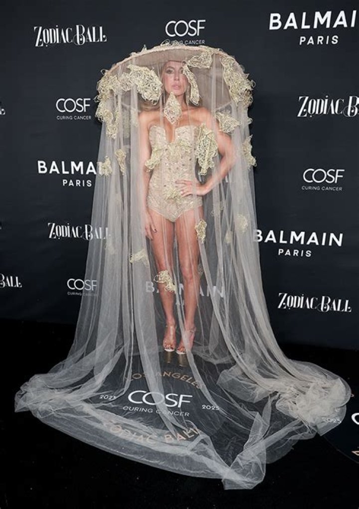 Kate Beckinsale Shows off Long Legs in a Body Suit & Sheer Veil at LA Event