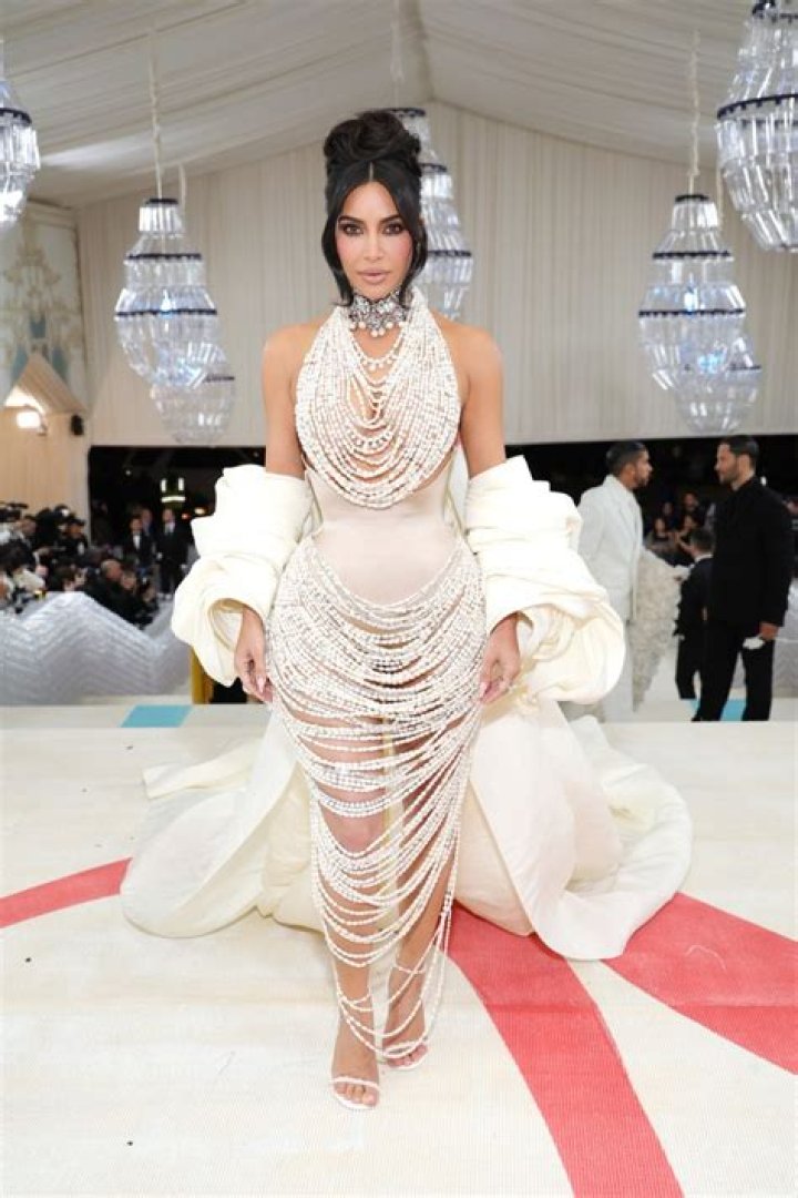 Kim Kardashian Channels Cher With Plunging Latex Dress & Fringe Headpiece At Met Gala After-Party