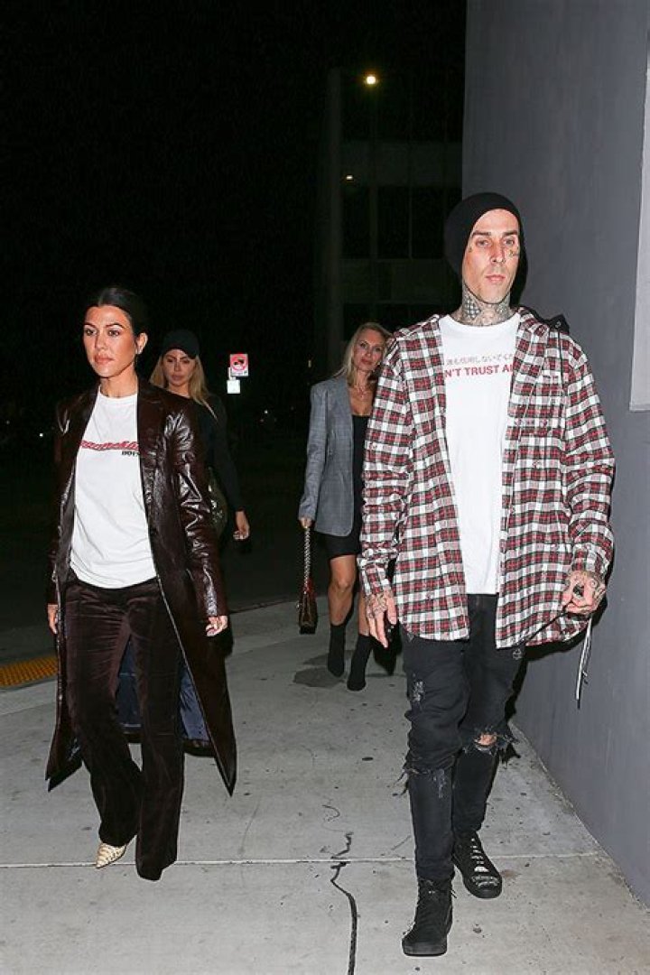 Kourtney Kardashian & Travis Barker Sweetly Hold Hands In Never-Before-Seen Pics From Her Birthday