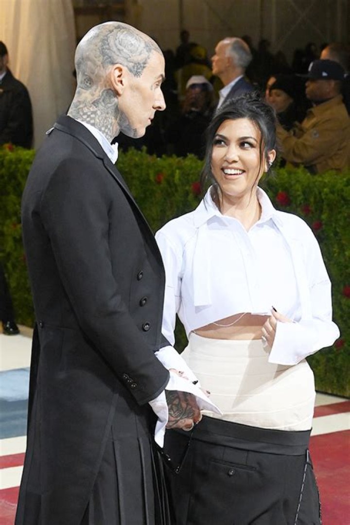 Kourtney Kardashian Rocks Sheer White Shirt & Holds Hands With Travis Barker On Honeymoon