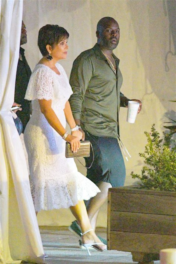 Kris Jenner, 64, Stuns In Lace White Dress & Holds Hands With Corey Gamble, 39, On Romantic Vacay