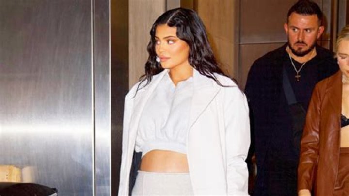 Kylie Jenner Puts Bare Baby Bump On Display In Crop Top & Unbuttoned Jeans — Photos