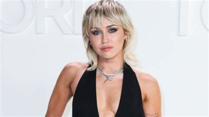 Miley Cyrus Checks Herself Out In The Mirror While Posing In A Halter Crop Top & Briefs
