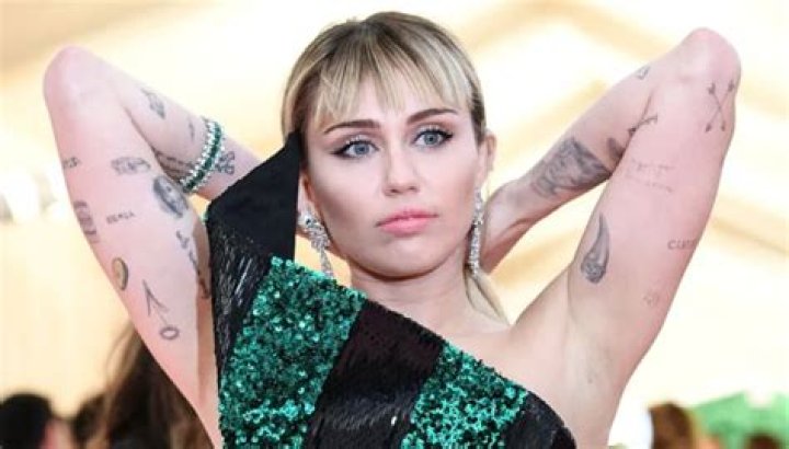 Miley Cyrus Got A ‘Babies’ Tattoo While Shooting ‘SNL’ — But What Does It Mean?