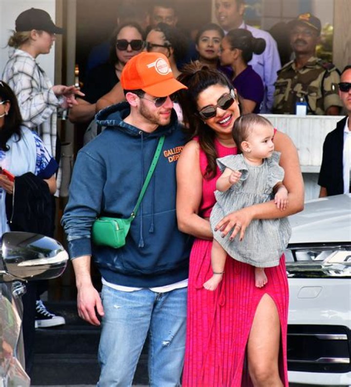 Nick Jonas Hugs Daughter Malti, 2, During Theme Park Trip: See Adorable Photos