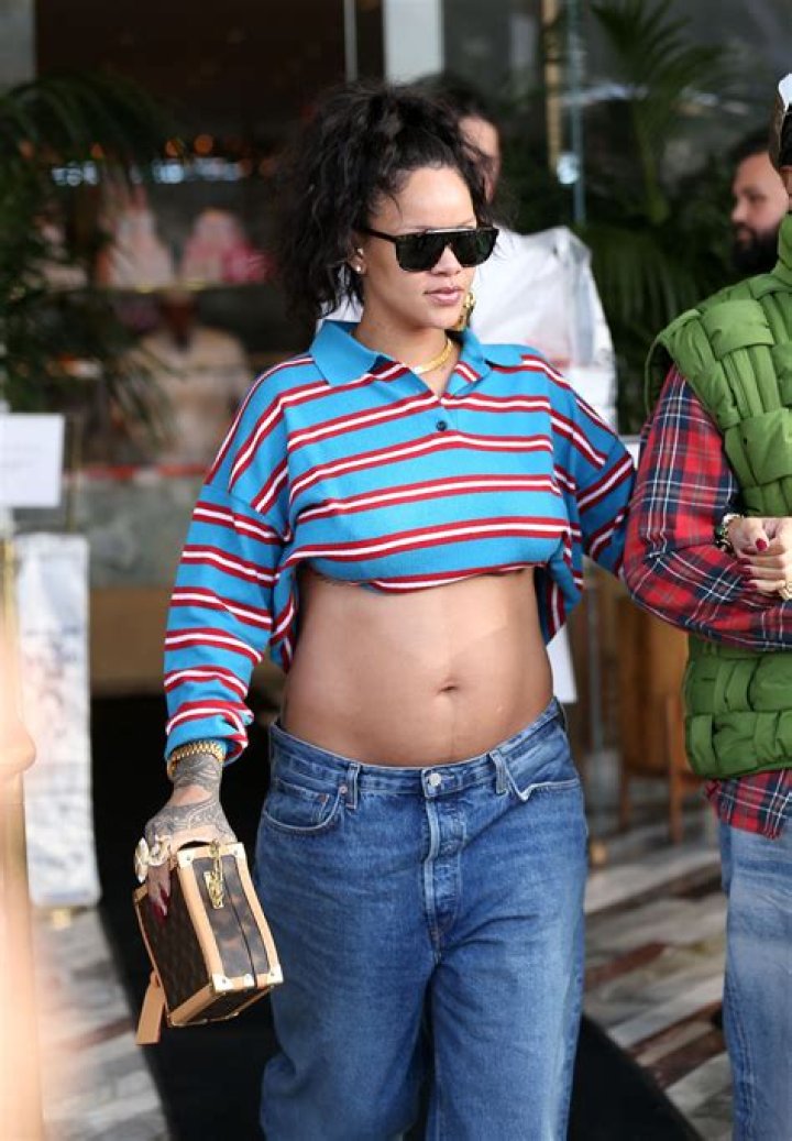 Rihanna Puts Bare Baby Bump On Display In Crop Top & Camo Jacket Ahead Of Baby No. 2