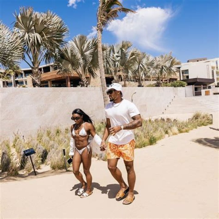 Simone Biles Rocks Sexy Backless Swimsuit & Admits She’s A ‘Happy Gal’