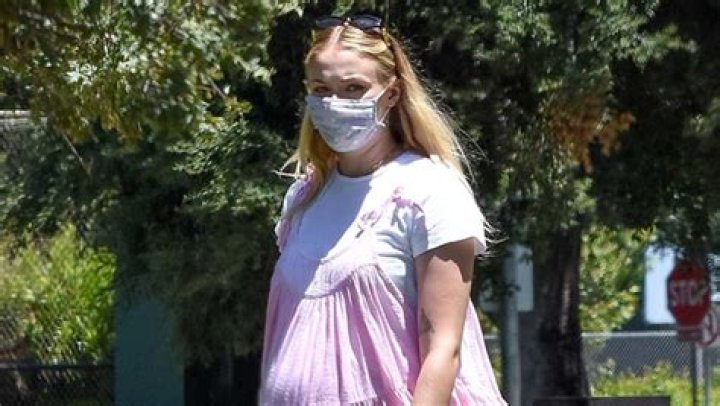 Sophie Turner Looks Ready For Baby’s Arrival in Pretty Pink Jumper With Joe Jonas
