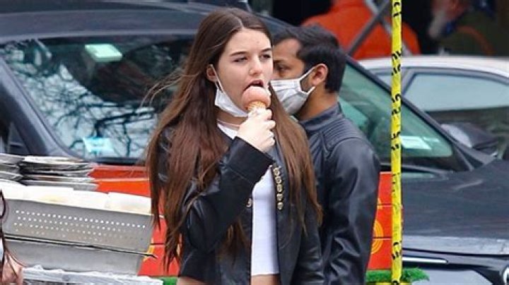 Suri Cruise Sports Long Hair While Posing With Flowers & Goofing Off With Friends On 15th Birthday