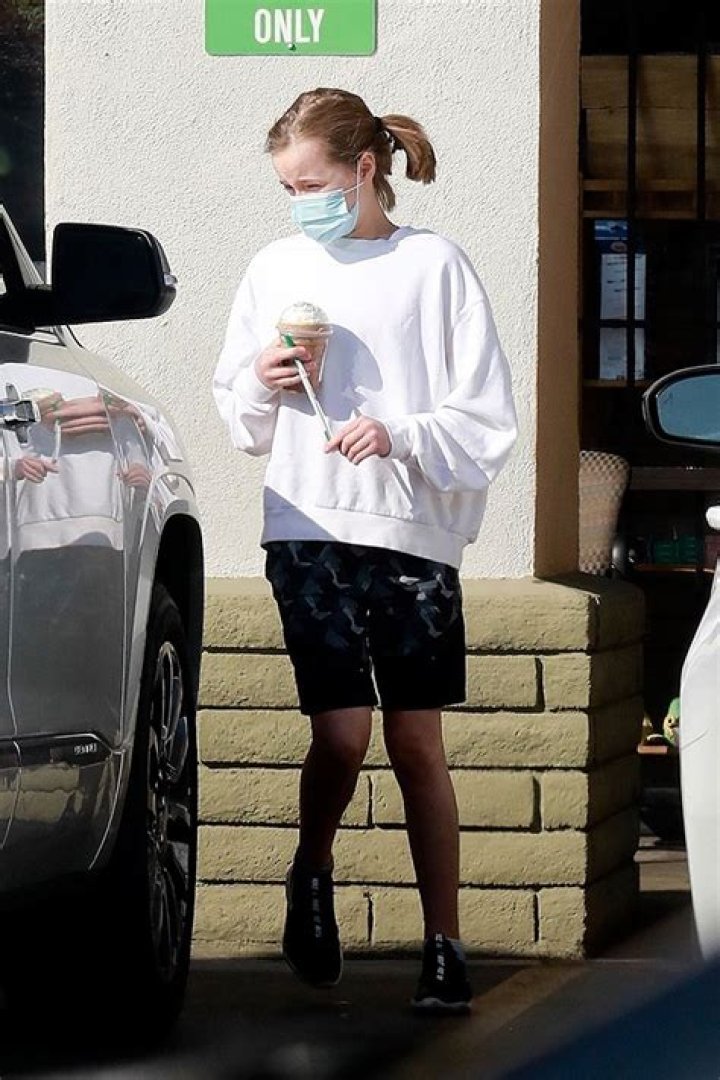 Vivienne Jolie-Pitt, 12, Steps Out In White Sweater & Black Shorts For A Solo Coffee Run — See Pics